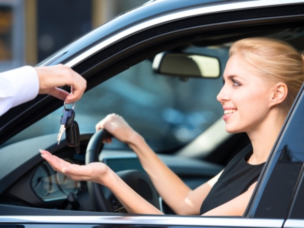 Woman Receiving a Car Key