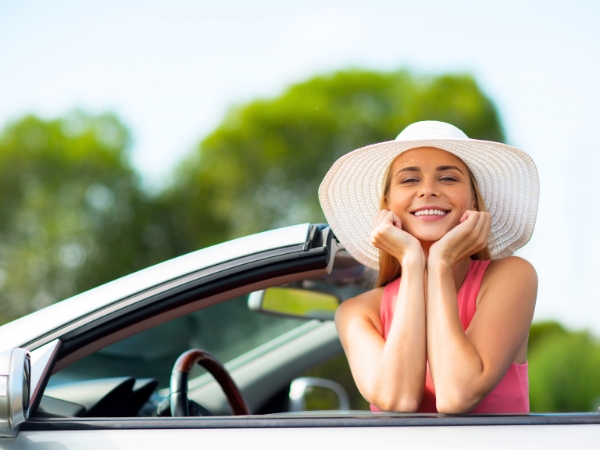 Woman Driving a Silver Car